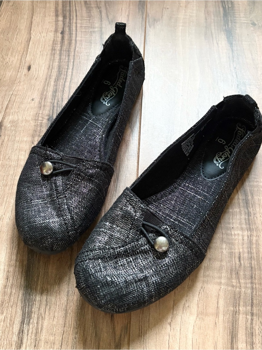 Black metallic button flats